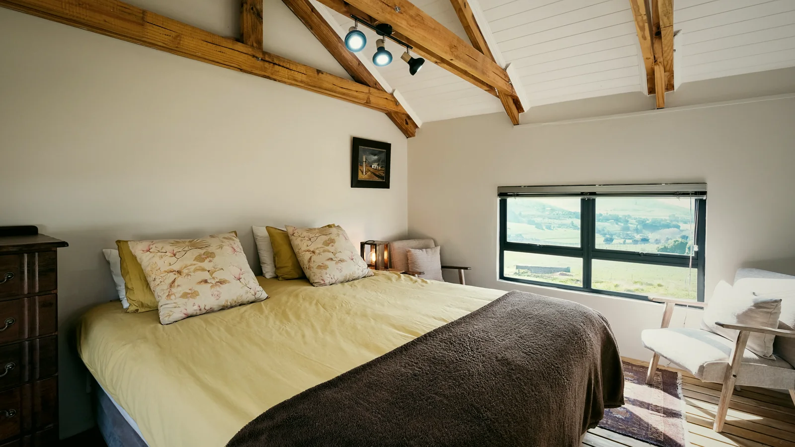 King bedroom under exposed timber beams